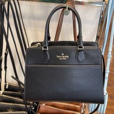 Kate Spade Madison Safiano Leather Medium Satchel Handbag Color: Black Madison Saffiano Leather Medium Kc436 Saffiano Leather Madison New With The Tag Authentic Product Details Measurements 11.8" W X 9" H X 5.6" D Handle Drop: 4.75" Features Strap Drop: 22" Metal Pinmount Logo Closure Type: Drop In Top Zip Closure Dust Bag Included: No Interior: Back Zip And Front Slip Pocket Exterior: Front Slip Pocket Materials Saffaino Pvc Lining: Two Way Script Logo Lining Imported Style Number Kc436 Ksny Ed Black Saffiano Leather Shoulder Bag With Leather Lining, Black Saffiano Leather Shoulder Bag For Office, Black Saffiano Leather Evening Bag, Black Epsom Leather Evening Bag, Formal Black Saffiano Leather Shoulder Bag, Elegant Satchel With Saffiano Leather And Leather Lining, Elegant Saffiano Leather Satchel With Leather Lining, Black Saffiano Leather Shoulder Bag, Elegant Black Saffiano Leather Shoulder Bag