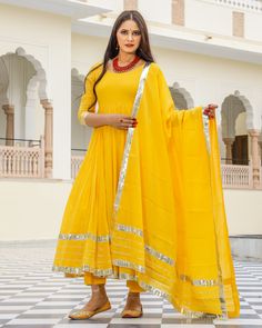 This 3 Pc anarkali Suit set is designed in mul-mul cotton fabric with Gota work mul-mul Dupatta. Kurta Length - 50, Mul-mul Cotton, Gota work With on hem & sleeves. Pant length - 38, Mul-mul cotton. Dupatta - Mul-mul cotton, gota work on edges. Fabric - mul-mul cotton. Color - Yellow CARE: dry clean only. Shipping - 10-12 working days. DISCLAIMER - The color of the product may be differ from the image 10-12% due to camera and lights and screen settings of device. Yellow Cotton Silk Anarkali Set With Cutdana, Anarkali Set With Cutdana In Mulmul, Yellow Mulmul Palazzo Set With Cutdana Details, Yellow Mulmul Palazzo Set With Cutdana, Yellow Mulmul Sharara With Traditional Drape, Yellow Anarkali Set With Cutdana Straight Kurta, Bollywood Style Yellow Cotton Silk Churidar, Yellow Anarkali Set With Cutdana, Yellow Bollywood Cotton Silk Churidar