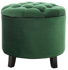 a green round ottoman with wooden legs