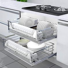 an open dish rack in the middle of a kitchen