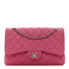 This is an authentic CHANEL Iridescent Caviar Quilted Jumbo Double Flap in Pink. This classic flap bag is crafted of tonal pink suede like caviar leather. The bag features a silver chain-link shoulder strap threaded with leather, a crossover flap, and a silver Chanel CC turn-lock on the front.  The flap opens to matching leather interior with patch pockets. Pink Evening Bag With Double Flap, Pink Double Flap Bag For Evening, Pink Double Flap Evening Bag, Classic Pink Bag With Magnetic Closure, Luxury Pink Bag With Magnetic Closure, Luxury Pink Bags With Magnetic Closure, Chanel Double Flap, Chanel Crossbody, Chanel Flap Bag