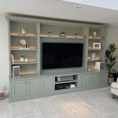 a large entertainment center with built in shelves