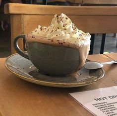 a cup of hot chocolate with whipped cream on top