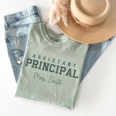 This custom assistant principal shirt is the perfect shirt to wear for an assistant principal! The shirt can be bought for a friend or loved one. The shirt is made with the highest quality of materials and is super comfy, soft and long lasting!! If you would like a different colored shirt, feel free to message me and I can specially make that design for you in the listed colored shirts in the pictures within the listing.    Please enter the name of the assistant principal you would like printed Principal T Shirts Ideas Design, Instructional Assistant Shirts, Vice Principal, Funny Principal Shirts, Assistant Principal Sublimation Tshirt, Vice Principals, Assistant Principal, Principal Gifts, Comfort Color