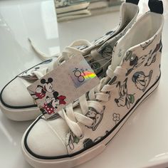 This Pair Of Canvas Shoes From Primark Is A Must-Have Addition To Your Footwear Collection. The Shoes Feature A Fun Disney Character Design That Is Sure To Catch Everyone's Attention. Available In Uk Shoe Size 5, Fitting Size 8 Us Women’s- These Unisex Trainers Are Perfect For Both Men And Women. The Multicoloured Sneakers Are Ideal For Casual Outings, And They Are Customisable To Suit Your Taste. With Its Stylish Design And Comfortable Fit, This Pair Of Primark Disney 100 Canvas Shoes Is Perfect For Any Occasion. Casual White Sneakers With Character Print, Synthetic Sneakers With Character Print And Round Toe, Casual Mickey Mouse Lace-up Sneakers, Fun Sneakers With Character Print And Round Toe, Casual Low-top Sneakers With Character Print, Fun Cartoon Print Sneakers With Round Toe, Casual Low-top Mickey Mouse Sneakers, Disney Character Print Sneakers With Round Toe, Casual High-top Mickey Mouse Sneakers