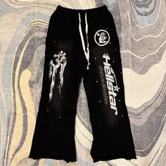 Hellstar Black Yoga Flared Sweatpants Mens Size Large Black Straight Leg Sweatpants With Letter Print, Graphic Print Pants For Winter Streetwear, Black Graphic Print Loungewear Pants, Graphic Print Trousers For Streetwear, Wide Leg Pants With Graphic Print For Streetwear, Black Graphic Print Sweatpants, Sporty Black Pants With Graphic Print, Black Wide Leg Bottoms With Graphic Print, Graphic Print Black Bottoms For Streetwear