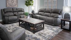 a living room with two couches and a coffee table in front of a window