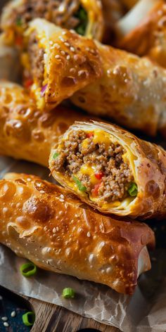 some tasty looking food items are sitting on wax paper and ready to be eaten