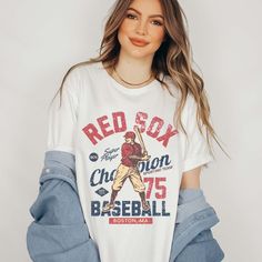 Step up to the plate in style with the "Vintage Baseball Team" Tee, showcasing iconic designs of your favorite baseball teams from the golden era of baseball. Crafted from premium fabric, this tee ensures both comfort and durability, making it perfect for honoring the rich history of America's favorite pastime. The vintage-inspired designs capture the nostalgia and heritage of classic baseball teams, bringing the spirit of the ballpark to your wardrobe. Whether you're cheering from the stands or Cotton T-shirt For Baseball Game Day, Baseball Jersey With Graphic Print For Game Day, Crew Neck Baseball Jersey For Baseball Season, Baseball Season Fan Apparel T-shirt, Fan Apparel Baseball Jersey With Crew Neck, Casual Baseball Jersey With Team Logo For Fans, Casual Baseball Jersey With Team Logo As Fan Merchandise, Casual Baseball Jersey With Team Logo, Baseball Season Jersey With Team Logo And Crew Neck