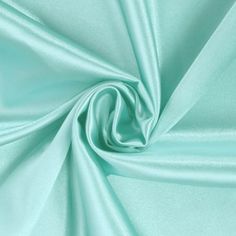 a close up shot of a light green fabric