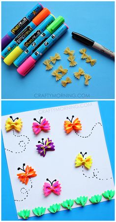 paper butterflies and crayons are on the table