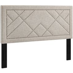 an upholstered headboard with studding on the sides and black legs, against a white background