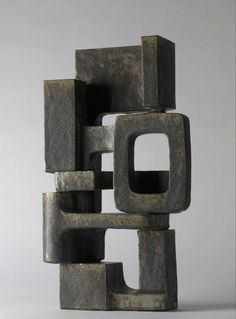 an abstract sculpture made out of metal blocks