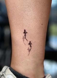 Tattoo ideas female Small Jaws Tattoo, Fish Inspired Tattoos, Shark Tattoo With Waves, Shark Mini Tattoo, Best Friend Shark Tattoos, Micro Shark Tattoo, Shark In Water Tattoo, Floating Shark Tattoo, Tattoo Ideas Female Shark