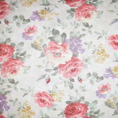 a floral print fabric with pink, yellow and purple flowers