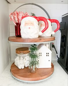 two tiered shelves with santa mugs and candy canes