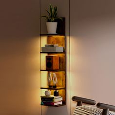 a room with a chair, lamp and bookshelf on the wall next to it