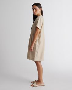 Short-sleeved, relaxed style. Super versatile and easy to wear. Featuring pin-tucking up top, shell buttons, and pleat detailing. Our linen collection is made from 100% European flax linen—an eco-friendly, and resource-light material.  | Quince | Women's 100% European Linen Short Sleeve Swing Dress in Driftwood, Size XL Short Sleeve Linen Dress For Workwear, Relaxed Fit Flax Linen Dress, Casual Neutral Linen Dress For Daywear, Casual Neutral Linen Day Dress, Relaxed Fit V-neck Linen Dress For Work, Casual Linen Pleated Dress, Casual Flax Linen Dress With Relaxed Fit, Casual Linen Dress With Relaxed Fit, Casual Relaxed Fit Linen Dress