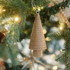 a wooden ornament hanging from a christmas tree