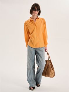 Evie is a staple for any sustainable capsule wardrobe. A tangerine dream in orange cotton-linen, this shirt is designed for an oversized or boyfriend fit. Crafted from responsibly sourced BCI member cotton, there’s a reason a linen shirt will always remain a classic. Oversized Orange Long Sleeve Shirt, Oversized Orange Shirt With Long Sleeves, Orange Relaxed Fit Top For Work, Workwear Orange Top With Relaxed Fit, Orange Cotton Blouse For Work, Casual Orange Shirt For Work, Casual Orange Shirt For Workwear, Casual Orange Cotton Blouse, Orange Button-up Cotton Blouse