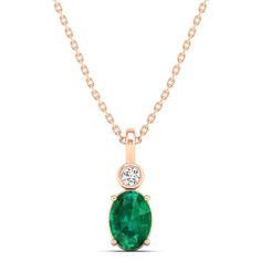 This exquisite oval-shaped emerald pendant is a true statement piece, exuding elegance and sophistication. Crafted with precision and attention to detail, the emerald is surrounded by sparkling diamonds, adding a touch of luxury to the design. Metal: 14K Gold Setting Type: Prong Rhodium Finish: Yes, on White Gold Gemstone Details: Gemstone: Emerald Shape: Oval Average Dimensions: 7.00 x 5.00 MM Quantity: 01 Average Cut: Very Good Average Color: Medium to Dark Green Average Clarity: Eye Clean Nat Oval Emerald Necklace With Diamond Accents, Oval Green Emerald Necklace With Diamond Accents, Elegant Oval Emerald Necklace With Bezel Setting, Oval Emerald And Diamond Necklace, Elegant Oval Emerald Pendant Necklace, Elegant Emerald Oval Pendant Necklace, Elegant Oval Pendant Emerald Necklace, Formal Emerald Oval Pendant Necklace, Elegant Oval Emerald Necklace For May Birthstone