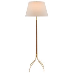 The Circus Floor Lamp elegantly interprets a transitional design. Beautiful curved solid Brass legs and turnings gracefully hold the Circus' carved tapered wood column. Place this lamp where layered lighting is needed. On/off switch located on the lamp's socket. UL listed. NOTE: LED bulb is included only when shipping to California. Layered Lighting, Wood Column, Brass Legs, Transitional Chandeliers, Flush Mount Lights, Hand Forged Iron, The Circus, Lamp Socket, Hand Carved Wood