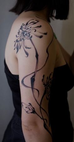 a woman with a tattoo on her arm