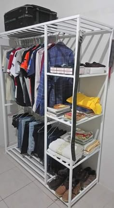 an organized closet with clothes and shoes