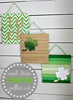 three wooden signs hanging on the wall with green and white chevroned paper strips