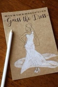 a notepad with a drawing of a woman in a dress on it and a pen next to it