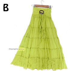 A tiered flared skirt with a fluffy cotton silhouette. Wide shirring and coconut buckle (removable) waist, lining. Very comfortable with nice and soft cotton,  even on hot days because of the high air permeability. You can also remove the buckle and wear it as a sash dress. Material ： Cotton100% Color ： Yellow Green Measurements  Length :  ９５ｃｍ（３７．４'） Waist :   ６０ｃｍ～１００ｃｍ（２３．６'～３９．４'） ＊Usual price ＄３３ 【 SHIPPING & DELIVERY 】 International Register  Air Mail to all over the world. The estimated d Green Tiered Maxi Skirt For Summer, Cotton Beach Skirt With Ruffles, Beach Cotton Skirt With Ruffles, Bohemian Tiered Cotton Maxi Skirt, Green Tiered Beach Skirt, Tiered Green Beach Skirt, Beach Ruffled Cotton Maxi Skirt, Beach Cotton Maxi Skirt With Ruffles, Cotton Ruffled Maxi Skirt For Beach