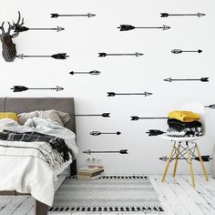 an arrow wall decal in a bedroom