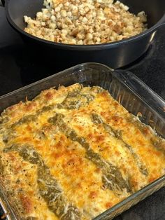 two pans filled with food sitting on top of a stove next to each other