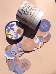 several round coasters and a can on a pink background with the words inner peace printed on them