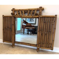 a mirror that has a piano in it