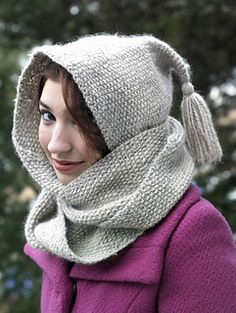 a woman wearing a knitted hat and scarf