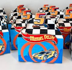 several boxes with cars on them sitting on a table