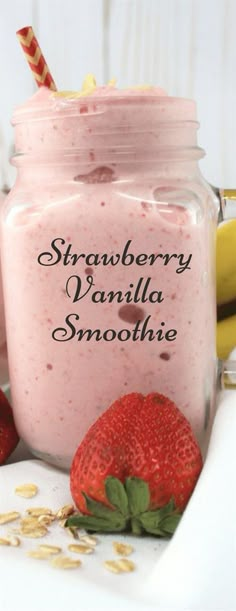 strawberry vanilla smoothie in a mason jar with strawberries