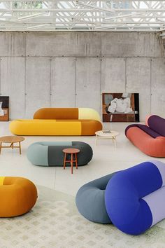 a room filled with lots of different colored furniture