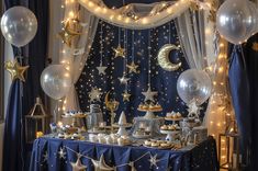 a table topped with lots of balloons and stars