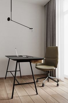 an office desk with a laptop on it in front of a window and a lamp