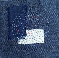 a piece of fabric with blue and white dots on it, in the pocket of a pair of jeans