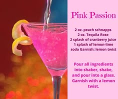 a pink passion cocktail with lemon wedges and garnished with a glass twist