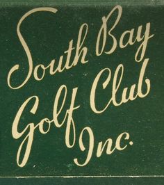 a green sign that says south bay golf club on it's front and side