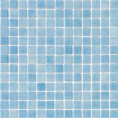 a blue tiled wall with small squares on it