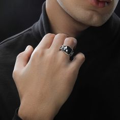 Dark Armor men's ring designed in sterling silver and black rhodium with a black onyx center stone. Gothic Black Stainless Steel Rings, Black Stainless Steel Skull Ring As Gift, Black Stainless Steel Skull Ring For Gift, Black Gothic Stainless Steel Skull Ring, Elegant Black Skull Ring In Sterling Silver, Elegant Black Sterling Silver Skull Ring, Black Stainless Steel Ring With Polished Finish, Elegant Black Stainless Steel Signet Ring, Black Enamel Sterling Silver Signet Ring