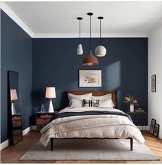 two pictures of a bedroom with blue walls