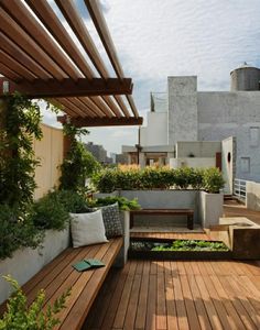 a wooden bench sitting on top of a wooden deck