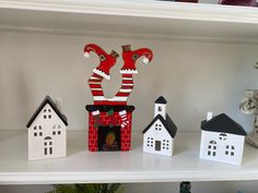 some christmas decorations are sitting on a shelf