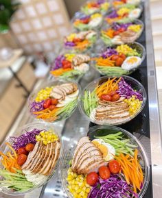 several plates filled with different types of food on top of a counter next to each other